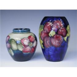 Two pieces of Moorcroft Pansy pattern wares, each with impressed marks (smaller vase minus lid...
