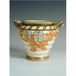 A Crown Ducal vase, designed by Charlotte Rhead, in the 'golden leaves' pattern, printed and f...