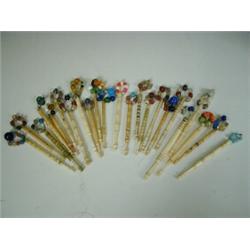 Twenty three various turned ivory and bone lace bobbins with coloured glass beads Est. 100/...