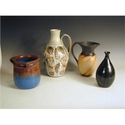 A Denby pottery pitcher by Glyn Colledge, 31cm high, a three handled Denby vase, a jug, impres...