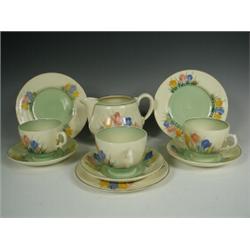 Clarice Cliff Spring Crocus pattern teawares: three tea cups, three saucers, three plates and...