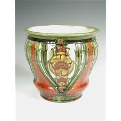 A Minton Secessionist jardiniFre, tube lined with flowerheads and stiff leaves, printed Minton...