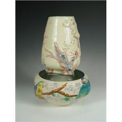 A Clarice Cliff 'Budgerigar' low vases (restored), together with another tapering and moulded...
