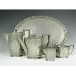 A 'Sunray' pewter four piece teaset and an oval tray, by Hutton, Sheffield, teapot 14cm high<b...