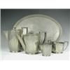 Image 1 : A 'Sunray' pewter four piece teaset and an oval tray, by Hutton, Sheffield, teapot 14cm high<b...