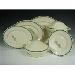 A Susie Cooper part dinner service comprising two tureens, three oval graduated dishes, a sauc...