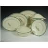 Image 1 : A Susie Cooper part dinner service comprising two tureens, three oval graduated dishes, a sauc...