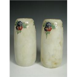 A pair of Royal Doulton stonware vases, with tube lined floral motifs and impressed with a mas...