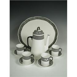 A Royal Worcester coffee set for four, with a tray on a low foot with black 'chequer' designs,...