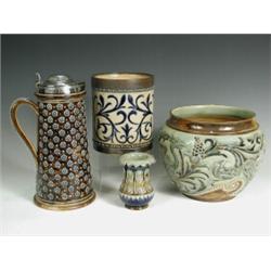 Four Doulton Lambeth items: a jug with a plated lid, 29cm, a jardiniFre with incised grotesque...