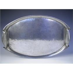 A Liberty oval pewter drinks tray, with a planished body, impressed marks to underside 'Solket...