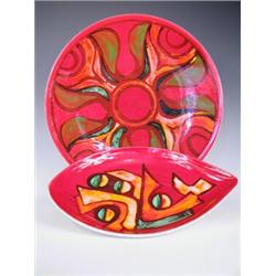 A large Poole Delphis pottery charger and a Poole pottery shaped dish, the latter with inscrib...