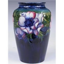 A Wm Moorcroft Anemone pattern vase, with blue initials to underside and impressed facsimile s...
