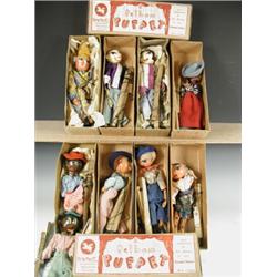 Nine early Pelham puppets, six with lead hands, the others wooden, all boxed except one, with...