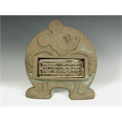 A Mickey Mouse electric heater, with a cast iron frame and label 'Tabard Fire Mickey Mouse, by...