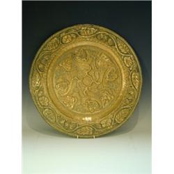 A Gearon brass charger with repousse foliage and chased decoration, stamped Gearon, 46.5cm dia...