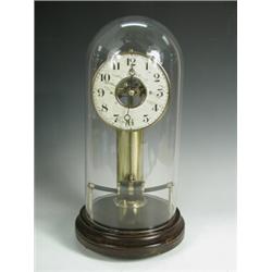 A 1920's Bulle electric dome clock, the battery housed in a central brass pillar on a turned m...