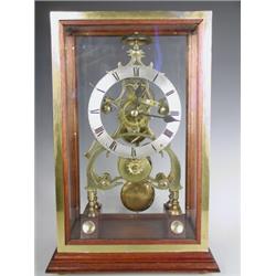 A 19th century brass skeleton clock with a fusee movement, (striking mechanism requires attent...