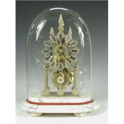 A 19th century brass skeleton clock with a single chain driven fusee movement, under a glass d...