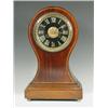Image 1 : An Edwardian mahogany balloon shaped mantel clock, with inlaid chequer banding, a black slate...