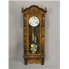Image 1 : A large walnut cased Vienna wall clock with Roman numerals and subsidiary seconds dial with sp...