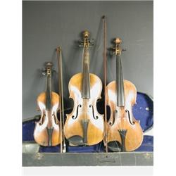 Two old violins with spurious labels, (one with a carved lions head), a bow marked 'J Pikadoul...
