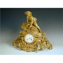 A 19th century gilt bronze mantel clock with a harvester tying a sheaf, and a striking French...