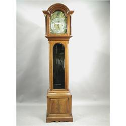 An early 20th century mahogany longcase clock, the arched brass dial with a silvered chapter r...