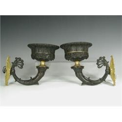 A pair of 19th century bronze and ormolu wall lights crisply cast with anthemions and foliage,...