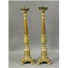 Image 1 : A pair of antique continental gilt wood candlesticks with carved decoration on triform bases a...