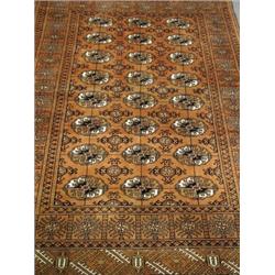 A modern rust ground handmade woollen Bokhara carpet, 1.83 x 1.22m Est. 160/200...