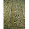 Image 1 : An Afghan light ground rug with geometric motifs and tasselled ends, 193 x 289cm Est. 200/2...