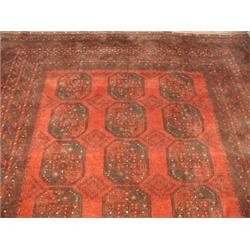 An Afghan rug with a red ground and wide border, 262 x 346cm Est. 190/250...