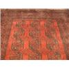 Image 1 : An Afghan rug with a red ground and wide border, 262 x 346cm Est. 190/250...