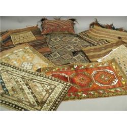 Various small rugs, weavings and a cushion Est. 50/100...