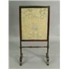 Image 1 : A late Victorian firescreen, 92cm high Est. 100/150...