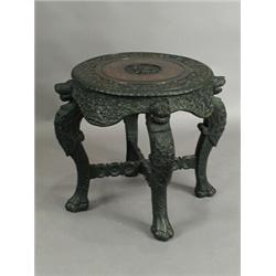 An oriental carved hardwood circular table, 60cm diameter Est. 200/300...