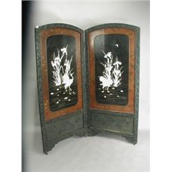 An oriental lacquered two fold screen with applied ivory and mother of pearl decoration, 1.83m...