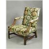 Image 1 : A Chippendale style mahogany library chair with blind fret carving and floral upholstery Es...