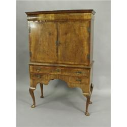 A William & Mary laburnum veneered cabinet, the interior housed within a late 19th century wal...