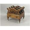 Image 1 : A Victorian rosewood Canterbury, with three pierced sections above a single drawer, on turned...