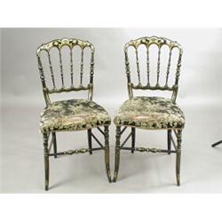 A pair of Victorian ebonised and gilt bedroom chairs, each with a stuff over and cane seat ...