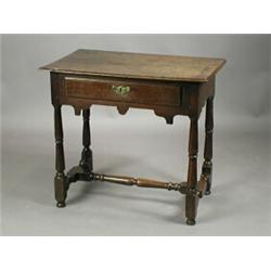 An early 18th century oak sidetable with a single drawer on turned legs, 74cm wide Est. 500...