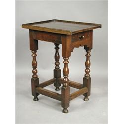 A small late 17th century oak table, the later top over a drawer, on baluster legs, 55 x 44cm<...