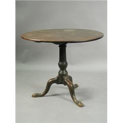 A George III mahogany tripod table, with a tapering column on pad feet, 87cm diameter Est....