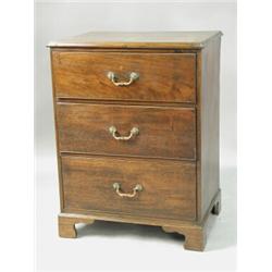 A George III mahogany chest of three short drawers with a moulded top and shaped bracket feet,...