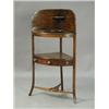 Image 1 : A George III mahogany corner washstand with a single drawer and united by a 'T' shaped stretch...