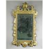 Image 1 : A George II style carved wood and gilt girandole, the bevel edged rectangular glass with an or...