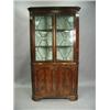 Image 1 : A stripped pine standing corner cabinet with four panelled doors and shaped shelves, 2.15m hig...