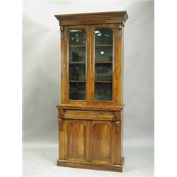 A Victorian mahogany bookcase, with two glazed doors over two panelled doors, 88cm wide x 202c...